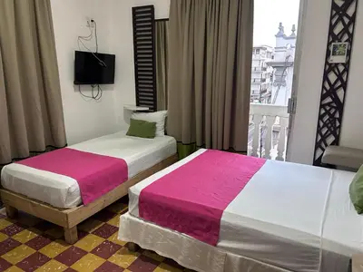Cama o camas de una habitación en Hotel puerta de mar