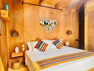 Cama o camas de una habitación en Suites Costa Madéro - Punta Zicatela