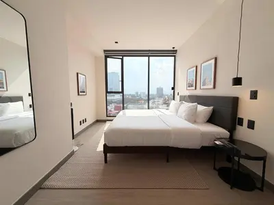 Cama o camas de una habitación en Modern Living in Be Grand del Valle