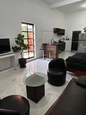 Una televisión o centro de entretenimiento en Loft Moderno y Acogedor