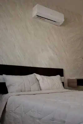 Cama o camas de una habitación en Puerta Paraíso Tranquilidad cerca del aeropuerto