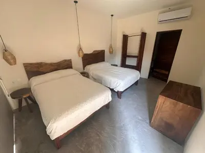 Cama o camas de una habitación en Hotel Almendros Bonfil
