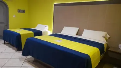 Cama o camas de una habitación en Autohotel Punto de Descanso Cordoba