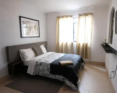 Cama o camas de una habitación en Casa Labardini Colonial Suite with Patio View 2