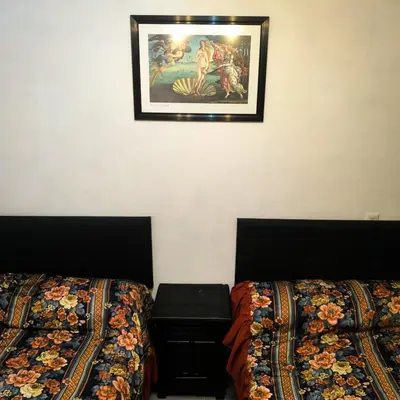 Cama o camas de una habitación en Hospedaje Don Juve