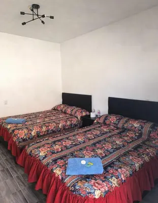 Cama o camas de una habitación en Hospedaje Don Juve