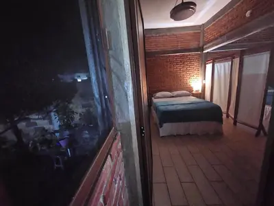 Cama o camas de una habitación en Casa Temazcal Madre Tierra