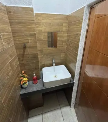 Un baño de La Perla residencia completa 3 habitaciones
