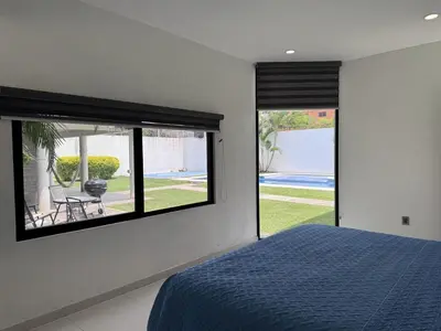 Cama o camas de una habitación en Casa lujosa con cancha de básquet y alberca