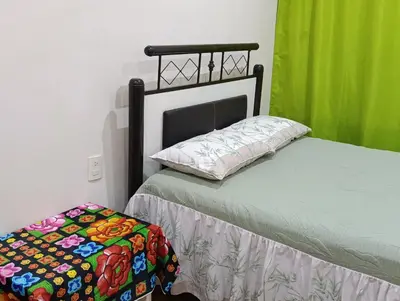 Cama o camas de una habitación en HABITACION PRIVADA CON BAÑO PRIVADO, VENTILADOR, WiFi Y RESTAURANT