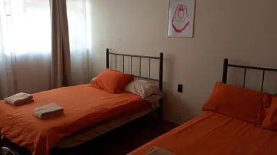 Cama o camas de una habitación en Hostal Kahlo - El sol y el viento- 4 personas