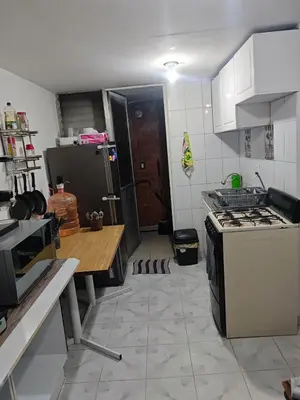 Una cocina o zona de cocina en Departamento a 10 minutos del aeropuerto