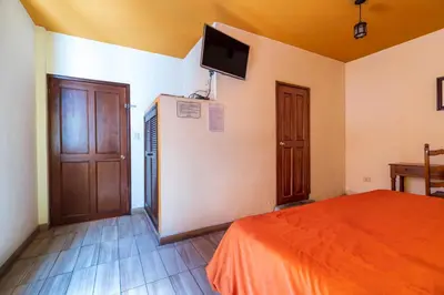 Cama o camas de una habitación en Mesón Real Hotel & Suites