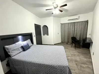 Cama o camas de una habitación en Departamento 5 Céntrico con WiFi y estacionamiento