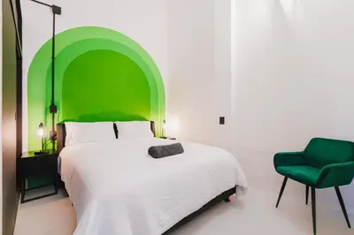 Cama o camas de una habitación en Cocoon Oaxaca City- Curated Stay In Oaxaca Centro