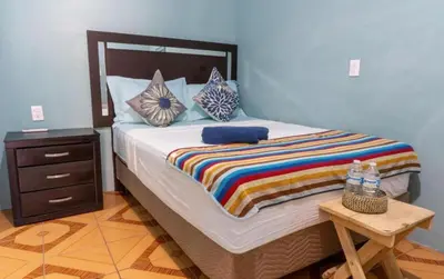 Cama o camas de una habitación en POSADA CENTRO MAZUNTE RINCONCITo