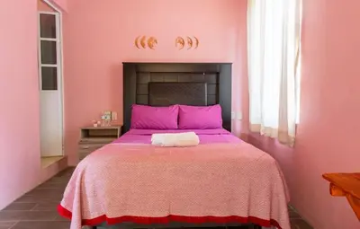 Cama o camas de una habitación en POSADA CENTRO MAZUNTE RINCONCITo