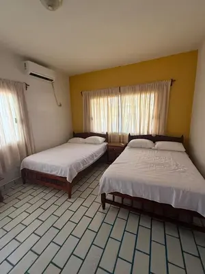 Cama o camas de una habitación en Casa Pelícanos playa de chachalacas