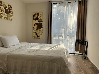 Cama o camas de una habitación en Depa a 10 min de Estadio GNP