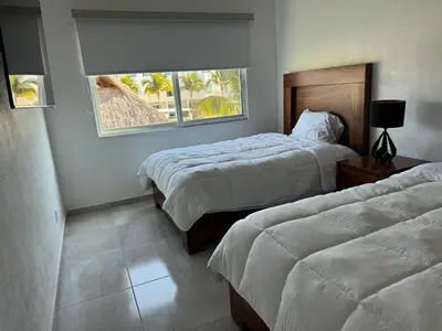 Cama o camas de una habitación en Villa Arlequín 1