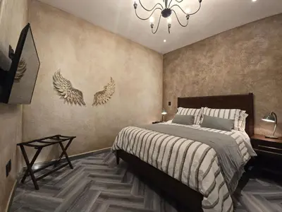 Cama o camas de una habitación en Departamento Zeus: Estilo y Confort en Val’Quirico