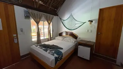 Cama o camas de una habitación en Hotel Frida Paradise