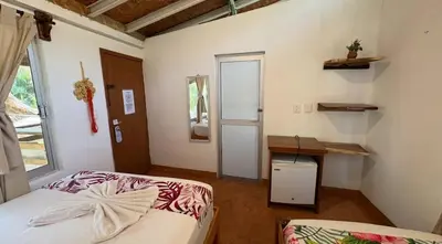 Cama o camas de una habitación en Hotel Frida Paradise