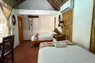 Cama o camas de una habitación en Hotel Frida Paradise