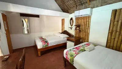 Cama o camas de una habitación en Hotel Frida Paradise