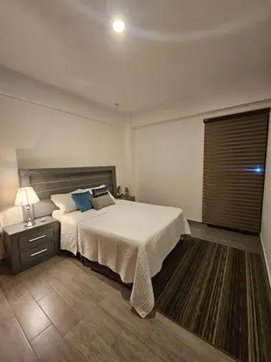 Cama o camas de una habitación en Lujoso departamento a una cuadra de la playa