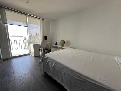 Cama o camas de una habitación en Suite Ejecutiva FINSA con Baño Privado y Parking