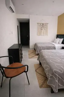 Cama o camas de una habitación en Villa en Acapulco Diamante
