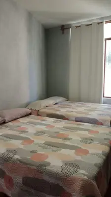 Cama o camas de una habitación en Quinta Corona Hospedaje Familiar