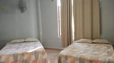 Cama o camas de una habitación en Quinta Corona Hospedaje Familiar
