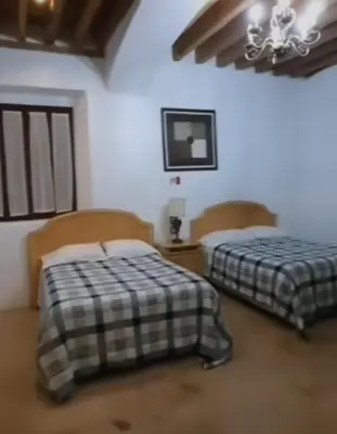 Cama o camas de una habitación en Hotel Real Casa Gloria