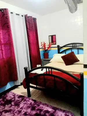 Cama o camas de una habitación en Tranquilo y familiar