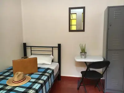 Cama o camas de una habitación en Hostal Andaina