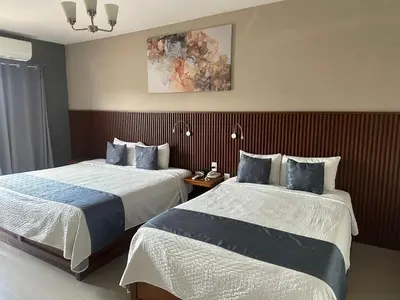 Cama o camas de una habitación en Hotel Pastora