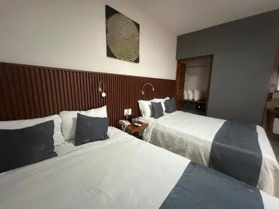 Cama o camas de una habitación en Hotel Pastora