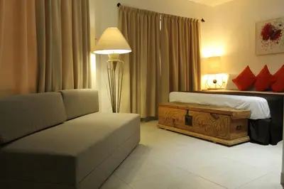 Cama o camas de una habitación en La Cochinilla Hotel Boutique