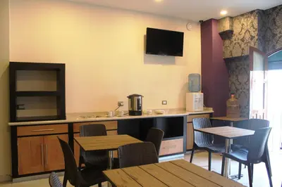 Una cocina o zona de cocina en Hotel Leones