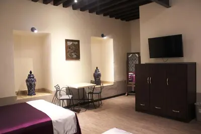 Una televisión o centro de entretenimiento en Hotel Gala