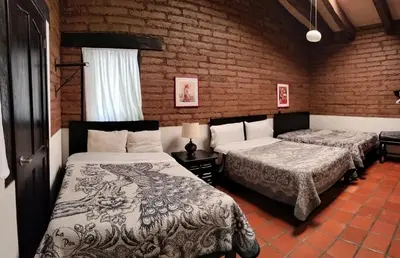 Cama o camas de una habitación en Cabañas y habitaciones Los Cedros