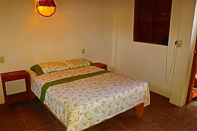 Cama o camas de una habitación en Cafe Maya - Casa Acalli