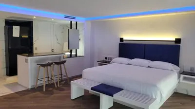 Cama o camas de una habitación en WeEnjoy Hotels Aeropuerto CDMX
