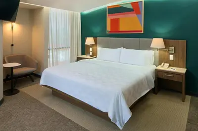 Cama o camas de una habitación en Holiday Inn Hotel & Suites Mexico Medica Sur by IHG