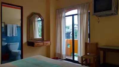 Cama o camas de una habitación en El Tucan