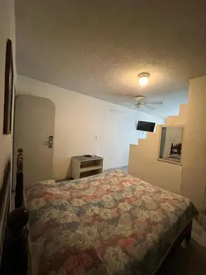 Cama o camas de una habitación en Hotel Suites Jazmín Acapulco