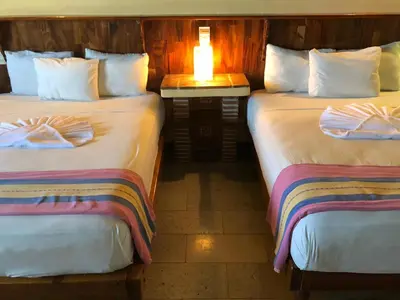 Cama o camas de una habitación en Hotel Arcoiris