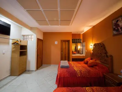 Cama o camas de una habitación en Hotel el Ángel Taxco